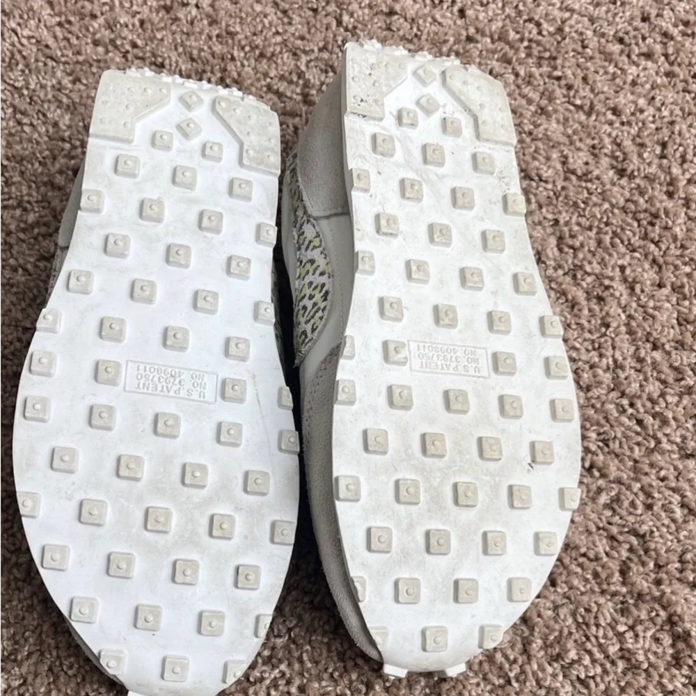 Nike Women's White and Gray Sneakers with Patterned Swoosh